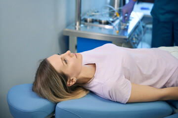 Female patient undergoing nasal procedure in medical clinic