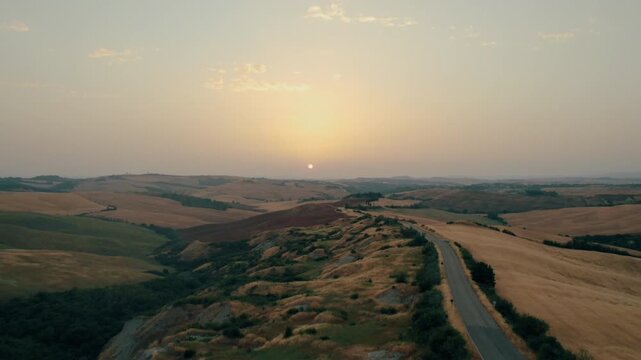 Aerial view of rolling hills at sunset