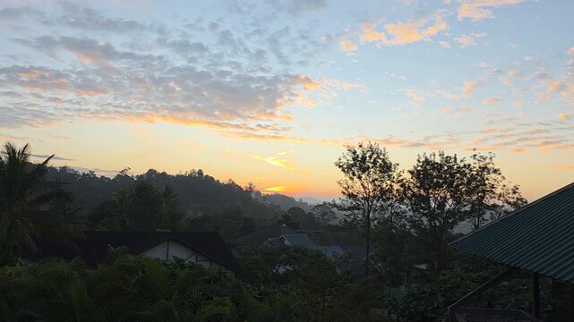 Sunrise over lush hills in Mannar, Kerala