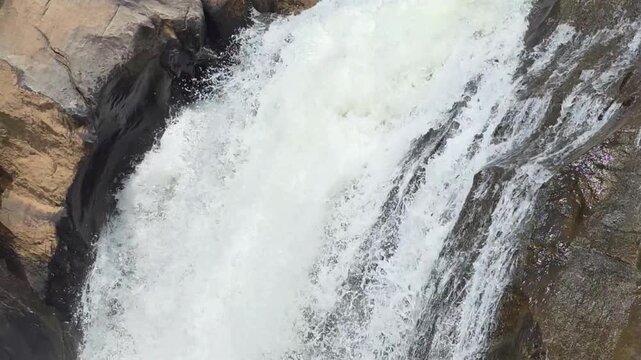 Waterfall cascading over rocks in Munnar
