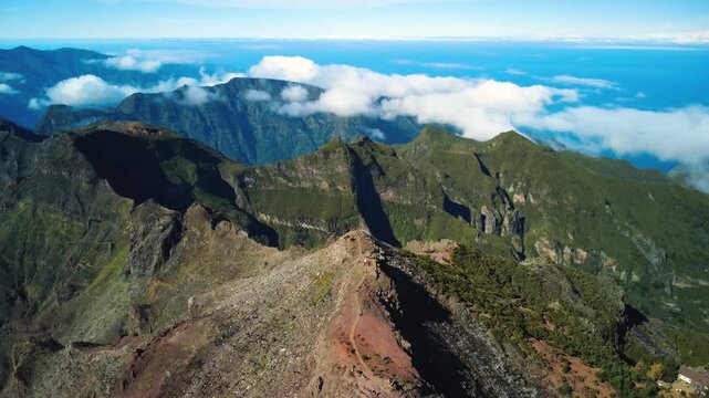 4K Drone Flyover of Pico Ruivo Summit, Madeira: Camera Tilt Down on Ridge Axis and Geodesic Marker, Hikers on Top Observation Decks, High Altitude Aerial Above Clouds, Majestic Volcanic Mountain