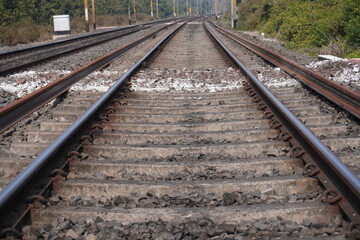 Low Angle Perspective of Railway Tracks with Gravel and Sleepers