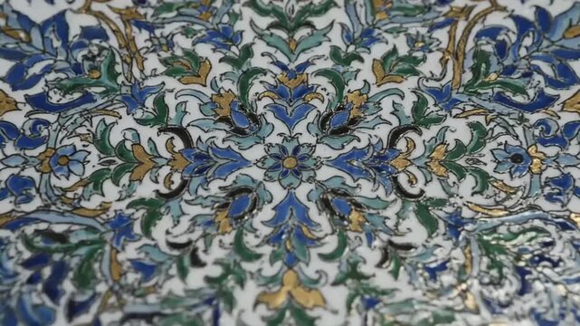 Intricate floral mosaic patterns in shades of blue, green, and gold, evoking timeless artistry and rich cultural heritage