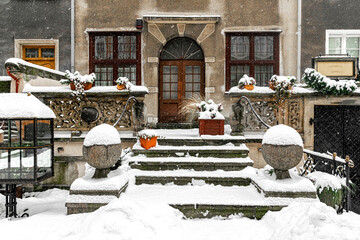 Porch of the medieval house covered with snow. Winter in Gdansk