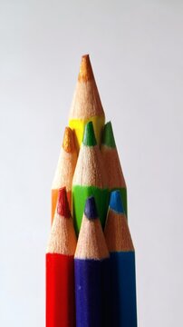 Top View of Colored Pencils Aligned in Gradient Order on Clean White Background for Creative Education Concepts