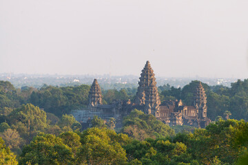 Angkor Wat, Cambodia, seen through the jungle in the late evening, summer