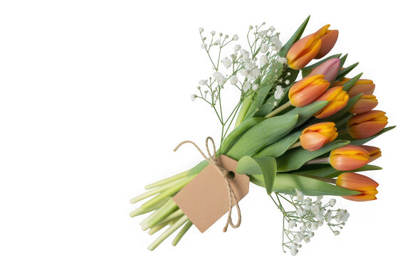 Bouquet of vibrant orange and yellow tulips with small white flowers isolated on transparent background