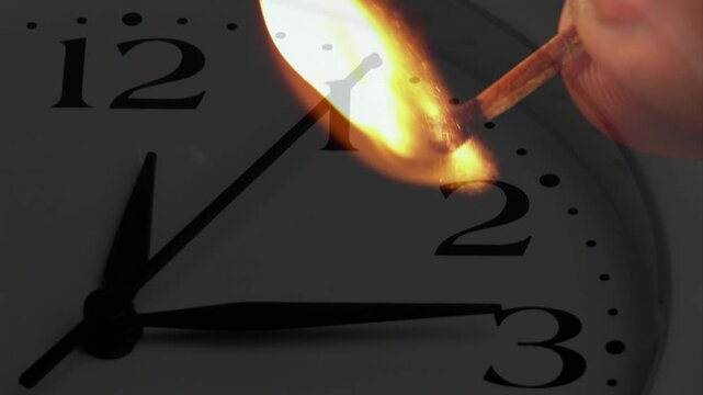 Struck match burning and moving toward numeral 2, hand guiding flame to mark passing time
