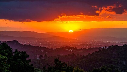 Obraz premium Golden Hour Over Rolling Hills at Sunset Atmospheric Landscape with Dramatic Sky and Warm Light.