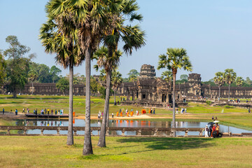 Angkor Wat, Cambodia, The complex grounds with hundreds or tourists and Buddhist monks in orange