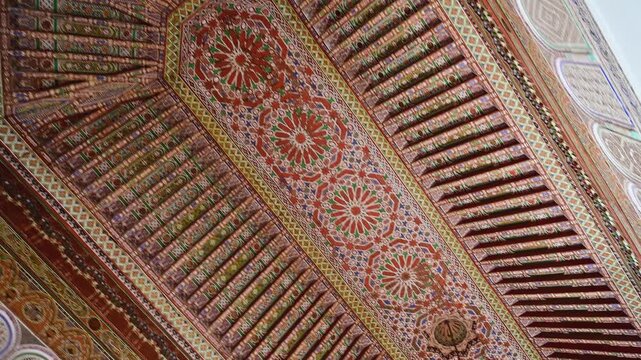 Detailed ornate ceiling inside Bahia Palace in Marrakesh, Morocco