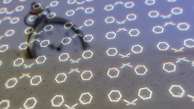 Focus pull antique pocket watch surfacing through sand while diffraction shifting to reveal dial