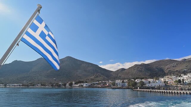 View From Ferry Moving Away From Tilos Town With Greek Flag, Greece