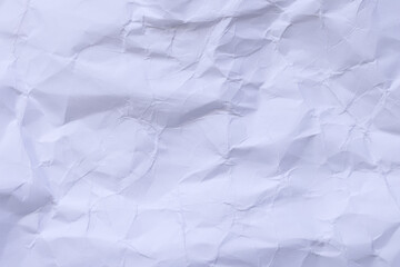Obraz premium Crumpled White Paper Texture Background,Macro,Close-up top view of a heavily crumpled and wrinkled white paper sheet texture. This abstract background features various folds, creases, and shadows, 
