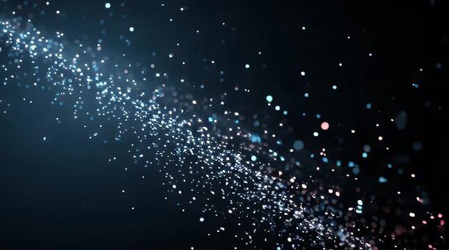 Animated particles flowing diagonally across a dark background in a video