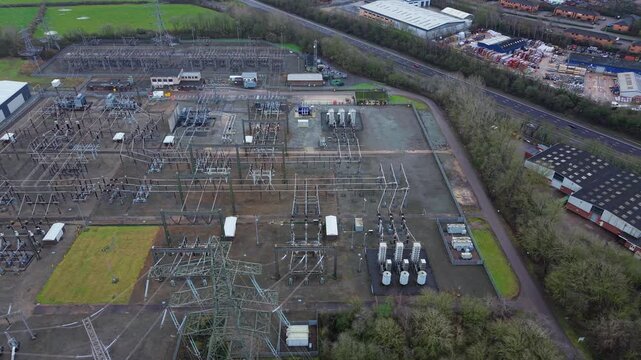 Aerial view of critical energy infrastructure and electrical power management systems for the Great Grid Upgrade and grid overload protection.