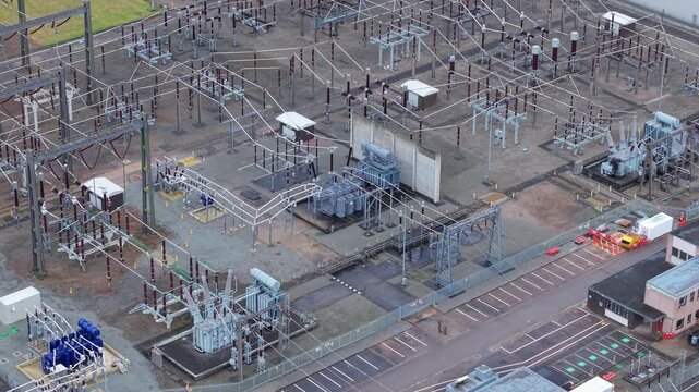 Technical aerial shot of substation busbar arrangements and high-capacity connectors at Enderby, highlighting grid resilience and power flow.