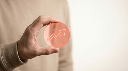 growth, success, business, arrow, investment, progress, finance concept showing a businessman holding a translucent orange disk with an upward graph for economic performance