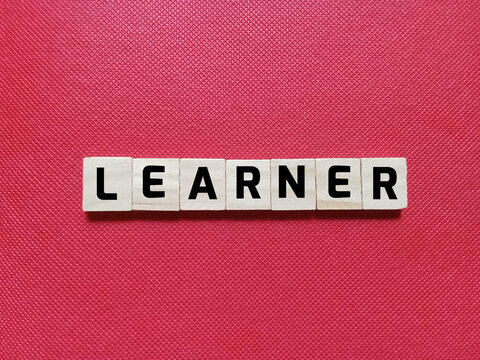 Alphabet letters of the word LEARNER on a red background. Concept about education and business themes.