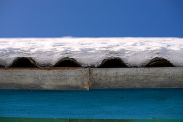 Old roof with snow and ice