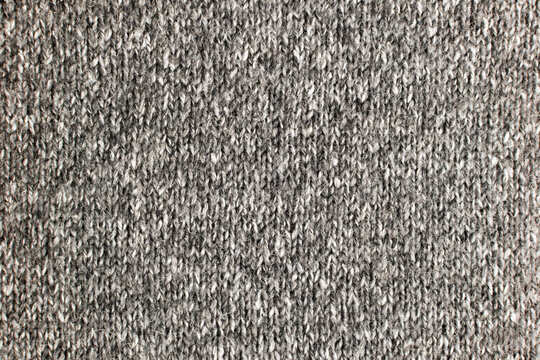 Close-up of gray melange knit fabric texture