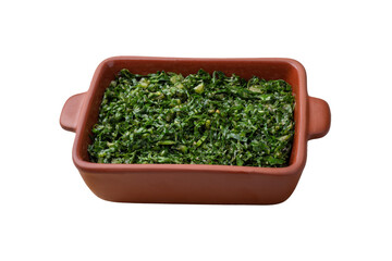 Cooked kale strips, typical brazilian feijoada sidedish in a plate isolated over white background