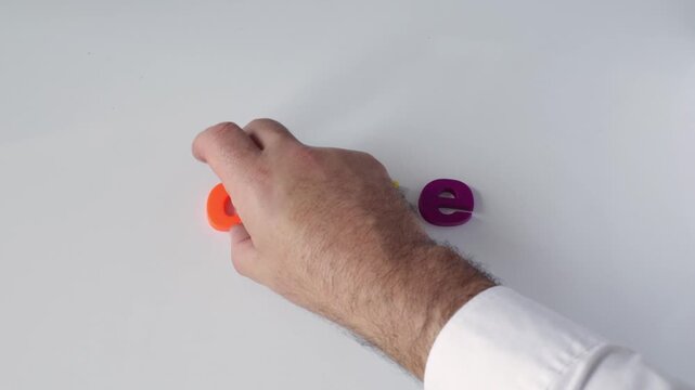 Dyslexia and learning disability concept, stop motion animation of colorful letters forming the word read on a white background