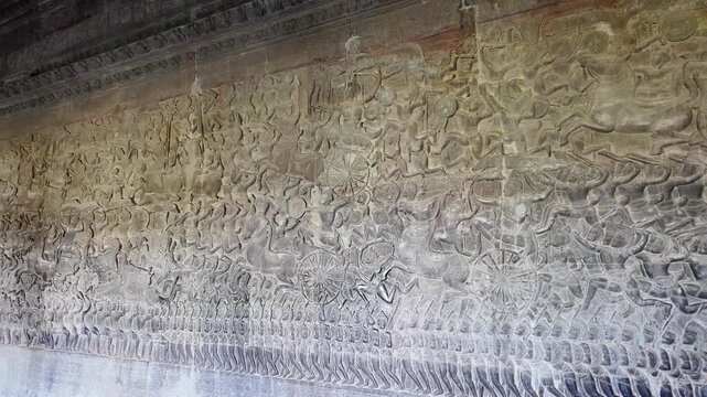 dramatic battle scene relief at angkor wat cambodia depicting mahabharata epic warriors on chariots