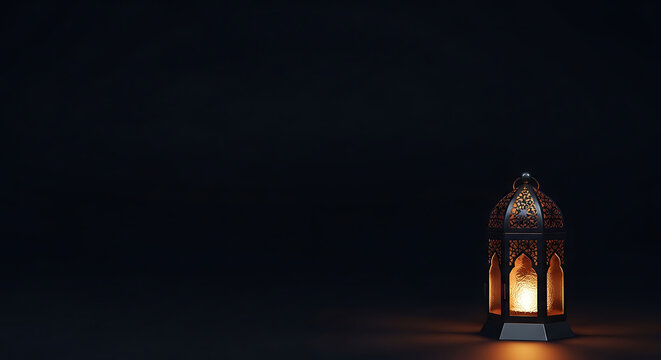 A dimly lit ornate lantern glows warmly against a stark black background