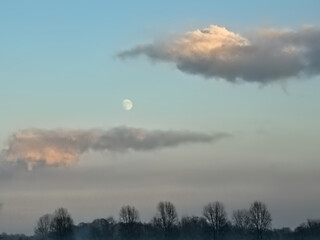  Colourfull evening sky with almost full moon.