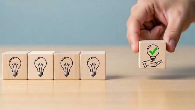 Hand picking a wooden block with a green check mark light bulb icon, representing choosing the best business idea or solution from options.