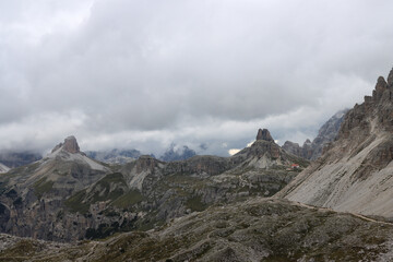 Fototapeta premium Atmospheric Dolomites panorama, Sasso di Sesto mountains dissolving into low‑hanging fog