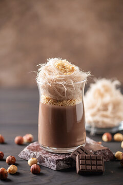 Persian Fairy Floss Pudding. Chocolate pudding or panna cotta with nuts and cotton candy or pismaniye or pashmak
