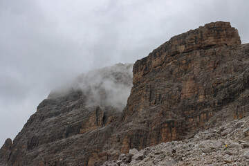 Jagged Dolomite cliffs surrounded by drifting mountain fog