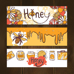 Honey Banner Overlay Collection with Bees, Flowers, Honeycombs, Jars, Barrels, and Dripping Honey Designs on Wooden Background