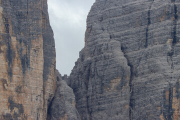 Fototapeta premium Rugged alpine rock wall, Dolomite cliff showing stratified formations in sharp detail