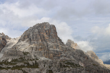 Fototapeta premium Rugged Dolomites peaks towering above alpine meadows near Locatelli Hut