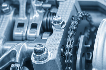 Fototapeta premium Close Up of Automotive Cylinder Head Parts in Light Blue Industrial Scene