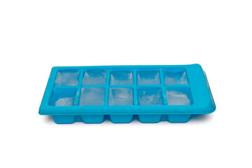 Naklejka premium Blue silicone ice cube tray isolated on a white background. Flexible kitchen accessory concept for freezing water, beverages, and homemade treats