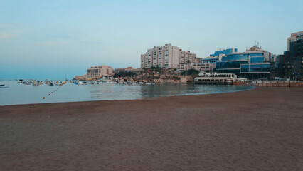 A public beach at the St Julian&rsquo;s Bay(San Giljan) and Urban Waterfront, Malta on sunny day