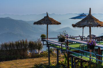 Beautiful sunrise in the morning with sea of mist on hight moutain, Mon Mok Tawan, Tak Province, Thailand.