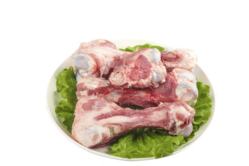 Fototapeta premium Fresh Raw Pork Bones with Marrow on Plate for Cooking and Bone Broth