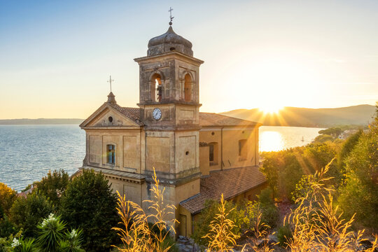 Church Assumption of Virgin Mary near Lake Bracciano at sunset in Italy