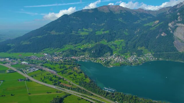 Aerial view of city Weesen beside the lake walensee in Switzerland on a sunny day in summer.