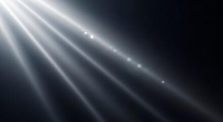 Light rays shining through darkness.