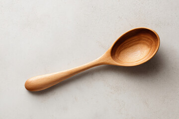 Wooden spoon flat lay on light surface with copy space for food and menu design