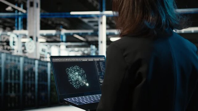 Data center female programmer using AI LLM model on laptop to optimize equipment rigs. Woman in server hub using large language model neural network technology to adjust system parameters, camera A