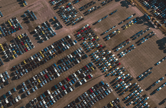 Aerial view of a vast, organized grid of tightly parked cars creates a textured mosaic of color and form, Cite des Pains, Nouvelle-Aquitaine, France.