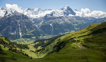 Majestic Swiss Alps Landscape with Green Valleys and Snow-Capped Peaks © tereshkov