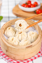 Freshly Made Steamed Pork Dumplings in Bamboo Steamer - Traditional Asian Dim Sum Ready to Enjoy